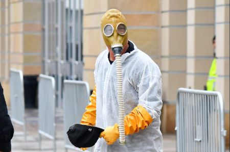 Howie Mandel wears a hazmat suit to America's Got Talent set.